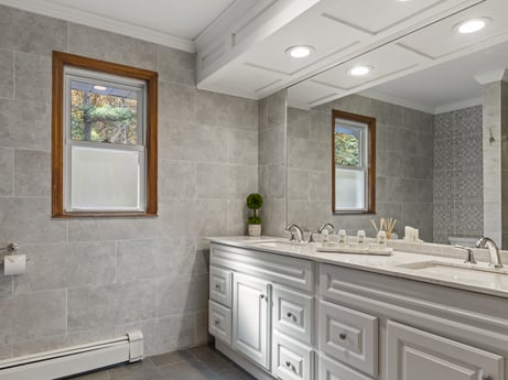 An image featuring bathroom cabinet, cabinetry, property, sink, building, plumbing fixture, tap, mirror, picture frame, drawer at 125 Rimstone Ct.