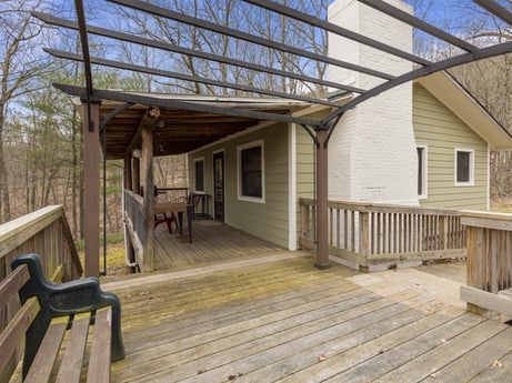 An image featuring property, building, window, sky, wood, cottage, siding, shade, beam, porch at English Hollow Ln.