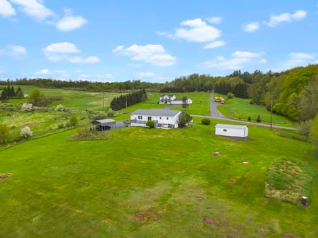 An image featuring sky, cloud, plant, tent, natural landscape, tree, land lot, highland, house, plain at 993 Dieffenbach Rd.