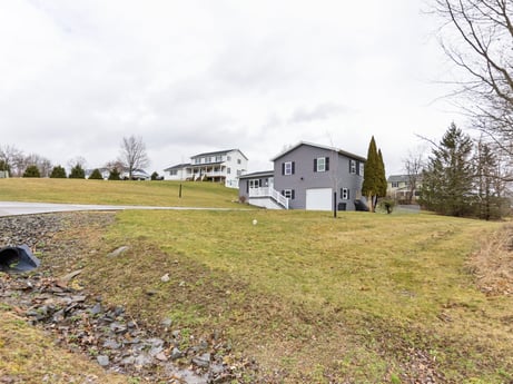 An image featuring cloud, sky, plant, building, tree, natural landscape, house, land lot, grass, landscape at 18 Country View Dr.