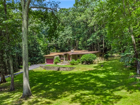 An image featuring plant, plant community, natural landscape, tree, shade, house, land lot, cottage, grass, groundcover at 104 Stony Mountain Rd.