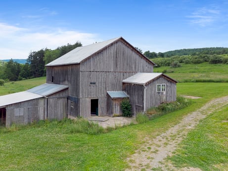 An image featuring sky, cloud, building, plant, wood, house, window, tree, cottage, natural landscape at 709 Creek Rd.