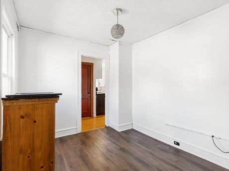 An image featuring building, cabinetry, wood, fixture, interior design, architecture, floor, flooring, wood stain, laminate flooring at 132 Wilbur St.