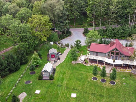 An image featuring plant, building, tree, land lot, natural landscape, house, biome, grass, urban design, landscape at 276 Mountain View Ln.