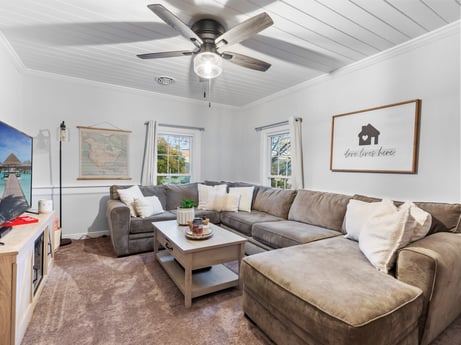 An image featuring furniture, picture frame, couch, ceiling fan, property, table, interior design, lighting, living room, wood at 17899 US-6.