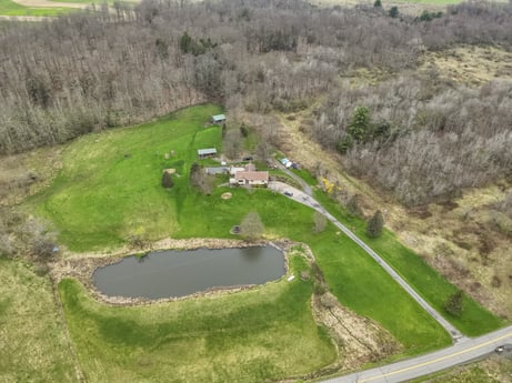 An image featuring plant, water resources, natural landscape, tree, land lot, biome, grass, landscape, urban design, water at 1569 S Macafee Rd.