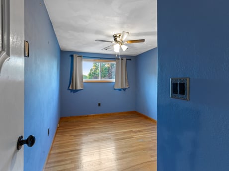 An image featuring building, fixture, wood, ceiling fan, paint, window, interior design, floor, wood stain, flooring at 491 Hillcrest Dr.