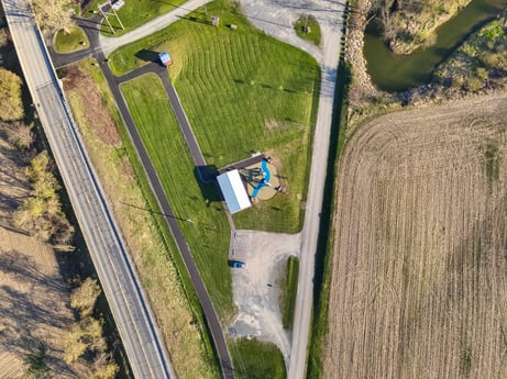 An image featuring plant, land lot, slope, tree, urban design, landscape, plain, grass, air travel, road at River Access Rd.