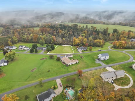 An image featuring cloud, plant, sky, property, mountain, tree, natural landscape, land lot, grass, biome at Country View Dr.