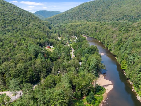 An image featuring water, cloud, mountain, sky, natural environment, natural landscape, plant, highland, tree, fluvial landforms of streams at 9224 PA-87.