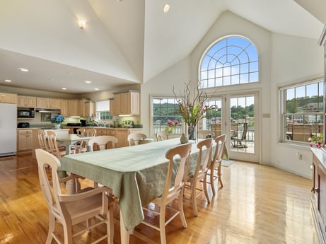 An image featuring table, furniture, property, chair, wood, window, lighting, interior design, kitchen & dining room table, floor at 218 Point Rd.