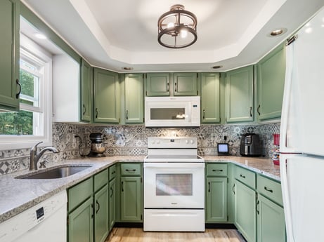A kitchen at 62 Leons Rd featuring: cabinetry, countertop, property, furniture, kitchen sink, sink, white, building, green, kitchen