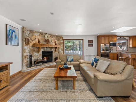 An image featuring furniture, picture frame, couch, wood, table, flooring, floor, living room, hardwood, real estate at 125 Rimstone Ct.