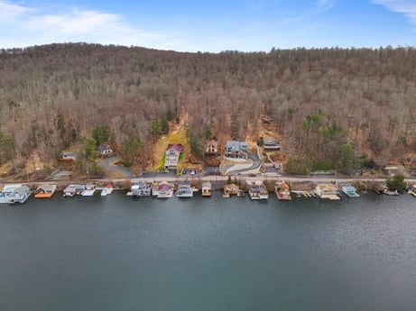 An image featuring water, water resources, sky, cloud, plant, vehicle, azure, tree, natural landscape, lake at 815 Lakeside Dr.