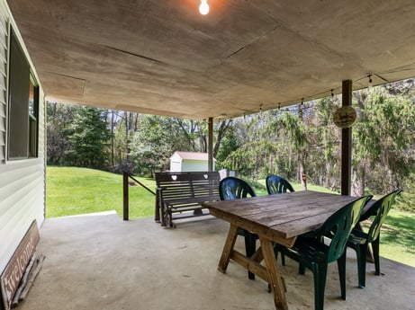 An image featuring plant, furniture, building, table, tree, wood, shade, porch, leisure, grass at 1039 Old Bernice Rd.