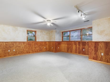 An image featuring building, property, window, wood, interior design, ceiling fan, shade, wood stain, floor, flooring at 74 Susquehannock Trail.