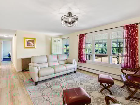 An image featuring furniture, property, couch, picture frame, wood, building, lighting, interior design, living room, flooring at 62 Leons Rd.