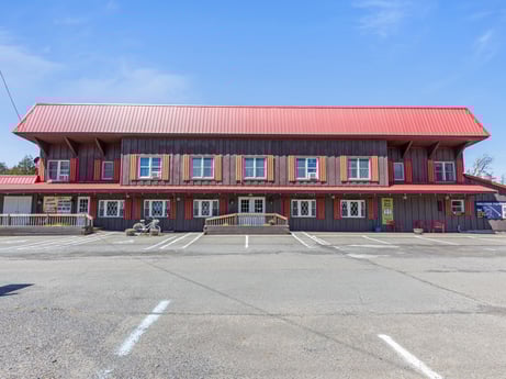 An image featuring sky, window, cloud, building, fixture, door, facade, city, asphalt, commercial building at 4741 US-220.