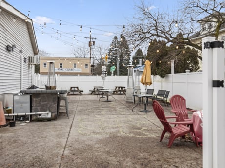 An image featuring sky, building, road surface, tree, public space, residential area, city, asphalt, human settlement, flooring at 199 State St.