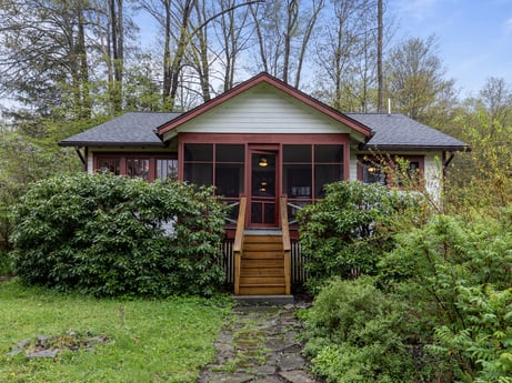 An image featuring plant, building, window, door, house, tree, sky, wood, land lot, cottage at 103 Mokoma Ave.