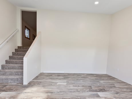 An image featuring building, wood, fixture, paint, grey, flooring, hall, floor, stairs, wood stain at 1195 Twin Cuts Rd.