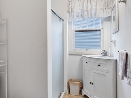 An image featuring cabinetry, bathroom cabinet, wood, window, floor, drawer, flooring, hardwood, bathroom, building at 103 Mokoma Ave.