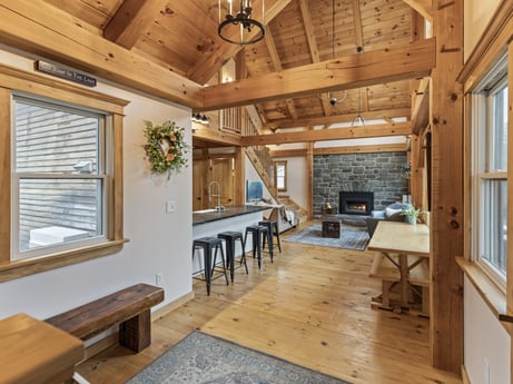 An image featuring table, furniture, window, wood, interior design, flooring, floor, beam, living room, couch at 144 Milton Ln.