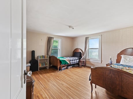 An image featuring furniture, window, wood, comfort, couch, interior design, flooring, chair, floor, building at 2399 Keene Summit Rd.