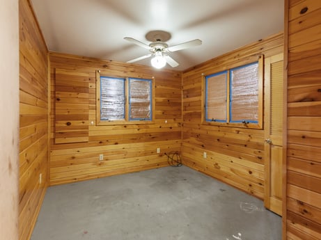 An image featuring property, ceiling fan, window, building, wood, fixture, interior design, beam, floor, flooring at 121 Marcy Rd.