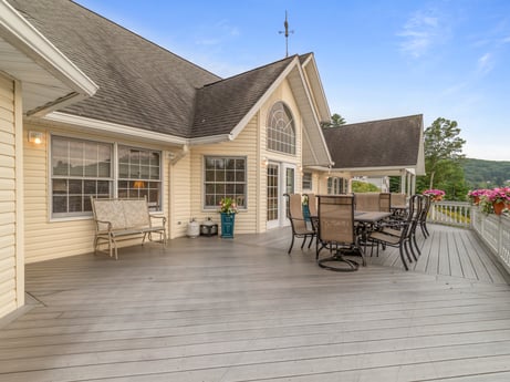 An image featuring sky, cloud, building, window, wood, house, porch, chair, cottage, plant at 218 Point Rd.