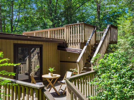 An image featuring property, building, plant, wood, tree, porch, cottage, wood stain, grass, siding at 104 Stony Mountain Rd.