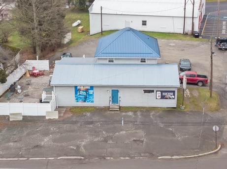An image featuring wheel, vehicle, window, tire, motor vehicle, road surface, car, building, asphalt, plant at 199 State St.