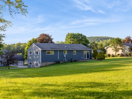 An image featuring sky, cloud, plant, building, window, tree, natural landscape, natural environment, house, land lot at 491 Hillcrest Dr.