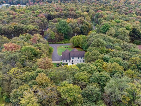 An image featuring plant, plant community, natural landscape, tree, highland, building, house, grass, woody plant, landscape at 92 Sunrise Dr.