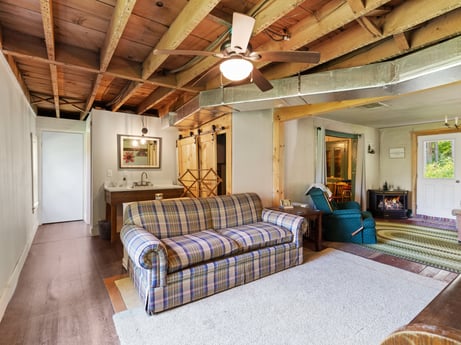 An image featuring building, property, comfort, wood, house, interior design, flooring, floor, beam, door at 1039 Old Bernice Rd.