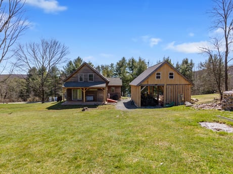 An image featuring sky, cloud, plant, property, building, tree, house, natural landscape, land lot, cottage at 144 Milton Ln.