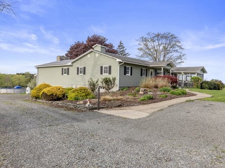 An image featuring sky, cloud, plant, window, building, tree, road surface, land lot, house, asphalt at 1195 Twin Cuts Rd.