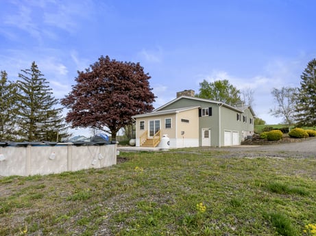 An image featuring cloud, sky, plant, building, tree, window, house, natural landscape, land lot, grass at 1195 Twin Cuts Rd.