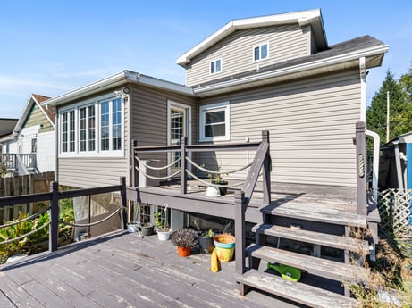 An image featuring sky, plant, property, building, window, wood, architecture, house, land lot, residential area at 132 Wilbur St.