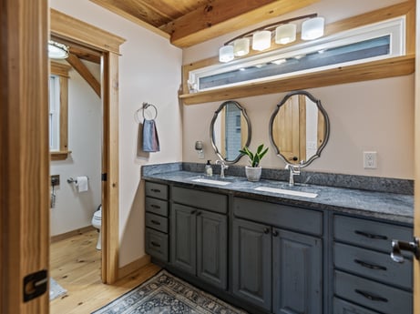 An image featuring mirror, cabinetry, tap, countertop, property, furniture, bathroom cabinet, sink, plumbing fixture, building at 144 Milton Ln.