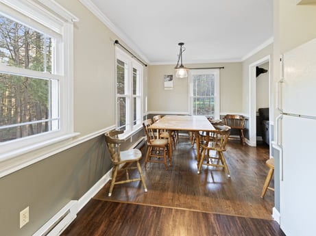 An image featuring table, window, couch, wood, interior design, fixture, hall, chair, flooring, floor at 1061 Muncy St.