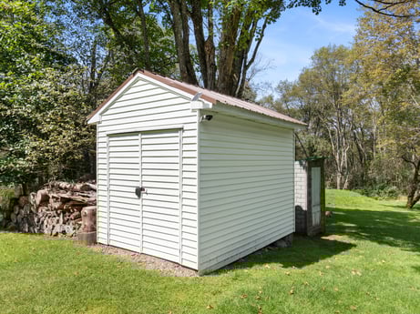 An image featuring building, plant, door, tree, wood, house, cottage, siding, landscape, grass at 1039 Old Bernice Rd.