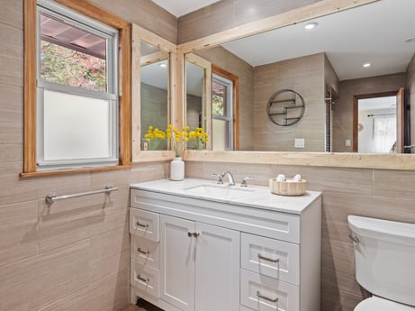 An image featuring mirror, brown, bathroom cabinet, tap, cabinetry, sink, furniture, property, plumbing fixture, building at 125 Rimstone Ct.