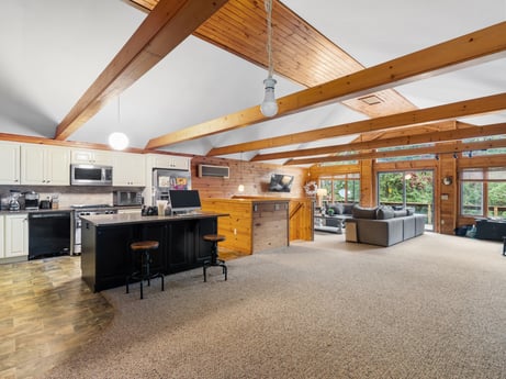 An image featuring furniture, table, wood, cabinetry, interior design, floor, chair, flooring, hardwood, hall at 125 Marcy Rd.