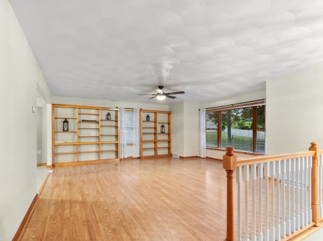 An image featuring building, wood, flooring, hall, floor, laminate flooring, wood stain, fixture, window, hardwood at 74 Susquehannock Trail.