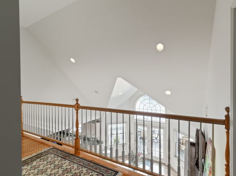 An image featuring wood, stairs, flooring, floor, building, fence, real estate, baluster, hardwood, handrail at 218 Point Rd.