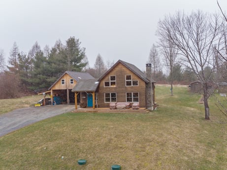An image featuring plant, sky, building, window, tree, house, land lot, grass, cottage, siding at 144 Milton Ln.