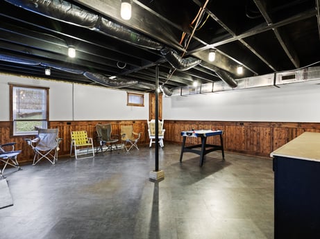 An image featuring furniture, hall, wood, interior design, floor, chair, flooring, table, hardwood, space at 1061 Muncy St.