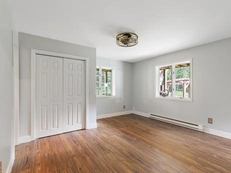 An image featuring property, fixture, building, wood, paint, interior design, hall, wood stain, flooring, wall at 276 Mountain View Ln.