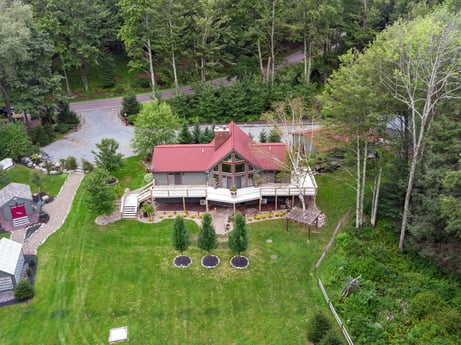 An image featuring plant, building, tree, natural landscape, land lot, house, grass, leisure, urban design, landscape at 276 Mountain View Ln.